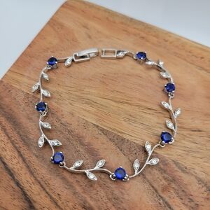 NWOT Rhodium Plated Greek Vine CZ Stones and Blue Stone Glass Dainty Bracelet